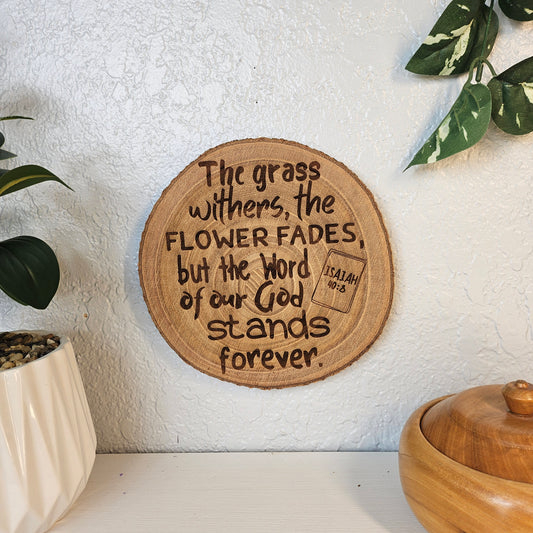 9 inch wood Slice of Scripture piece of Bible verse wall art displaying Isaiah 40:8 - Christian decorative art home decor